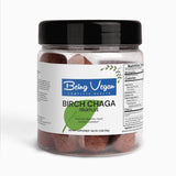 A close-up of Being Vegan Birch Chaga Truffles bottle, showing brown earthy truffles inside, packed with antioxidants and minerals, supporting gut health, digestion, and immune function naturally.