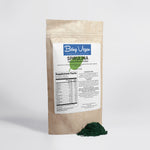 Being vegan green spirulina organic powder shown beside a brown package highlighting the natural health boosting benefits